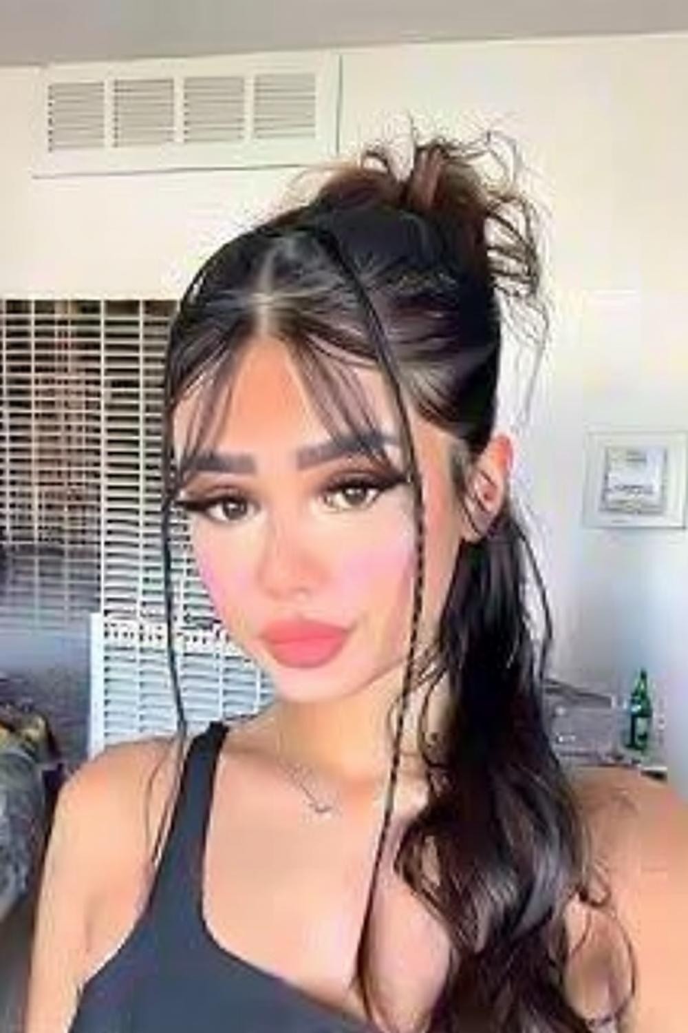 Messy Bun with Face-Framing Layers