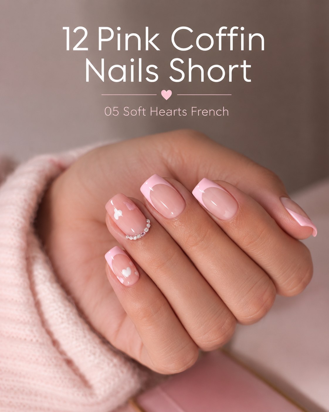 Short pink coffin nails in a soft hearts French design with a subtle rhinestone accent nail