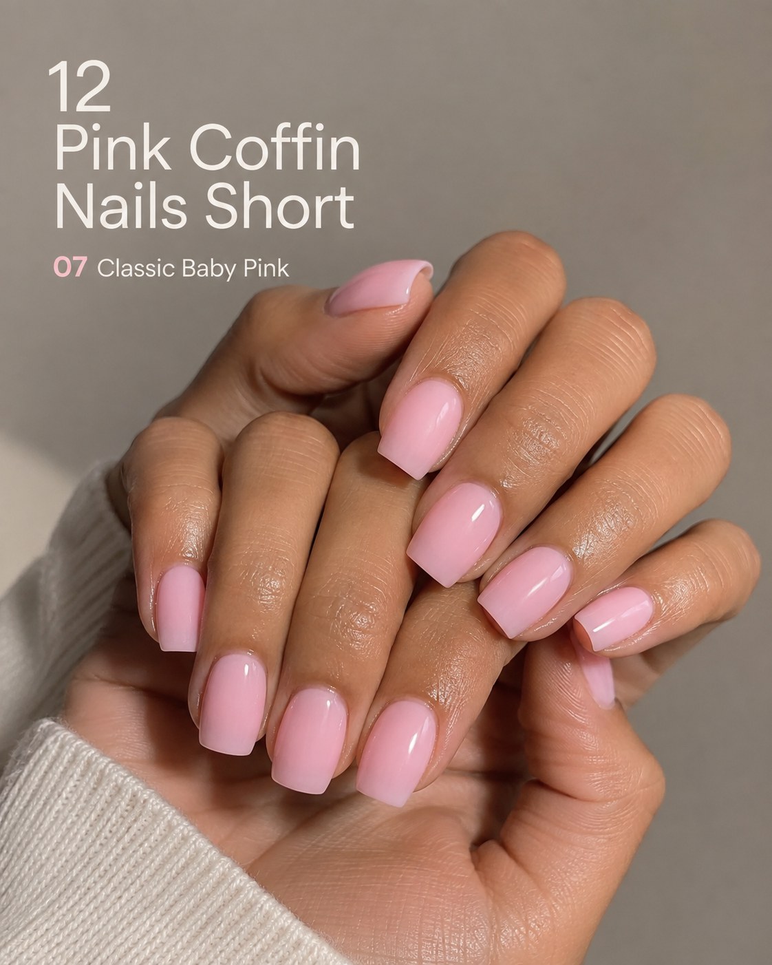 Short pink coffin nails in classic solid baby pink with a glossy high-shine finish