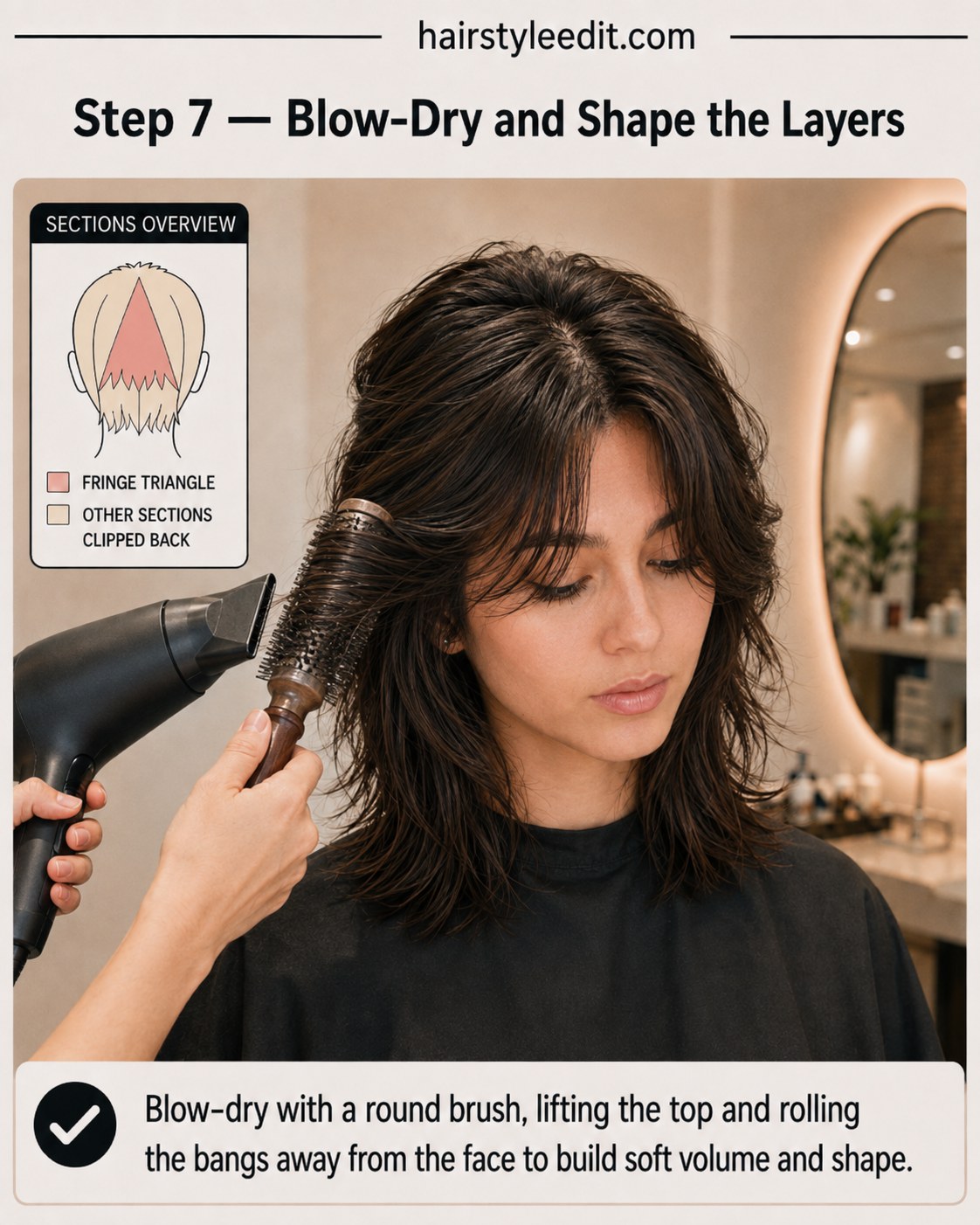 Round brush blow-dry lifting the crown and rolling curtain bangs away from the face on a shaggy wolf cut