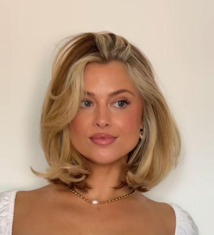 Woman with shoulder length bob 90s blowout hairstyle
