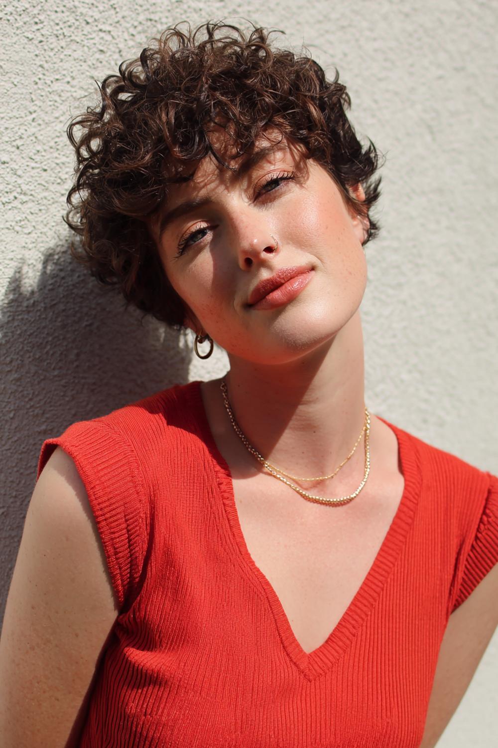 8. Short Hair Idea: Curly Pixie with Defined Ringlets and Clean Temples