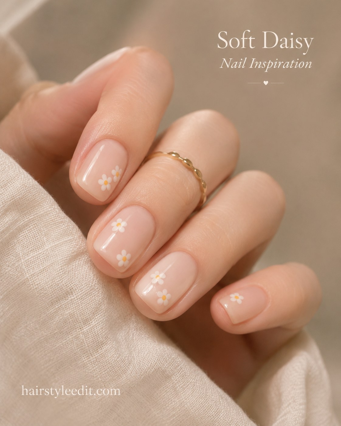 Sheer nude nails with tiny daisies show how short natural nail designs can look effortlessly pretty.