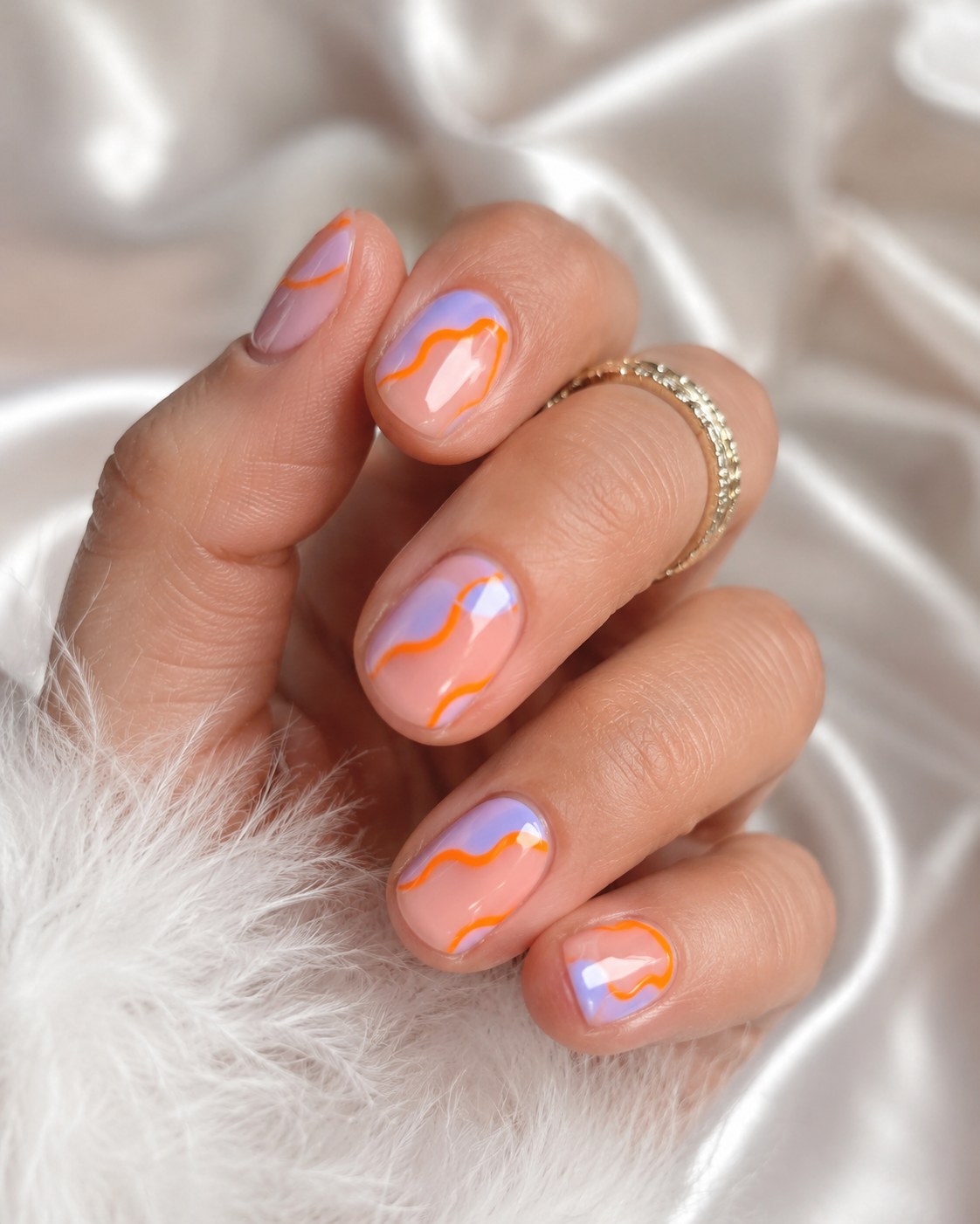 Peach and lilac abstract swirl marble design on short square summer nails