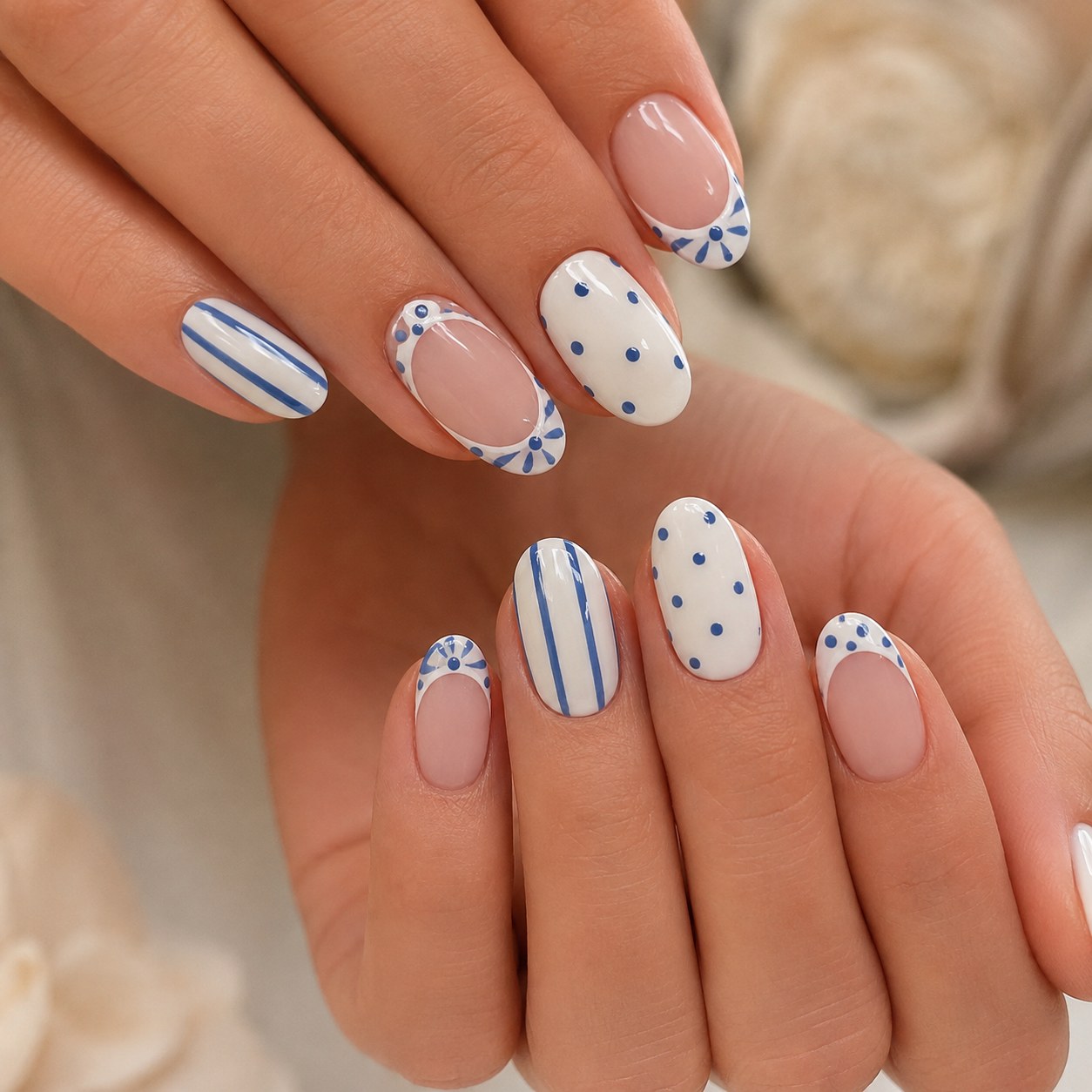 Nude short summer nails with blue polka dot and stripe Mediterranean-style patterns