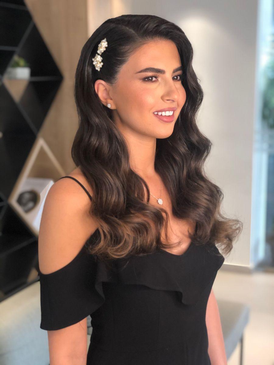 Side parted Hollywood waves hairstyle