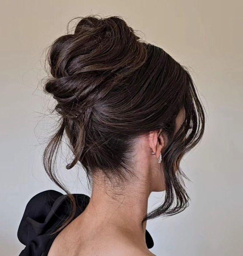 Sleek French twist with loose front strands