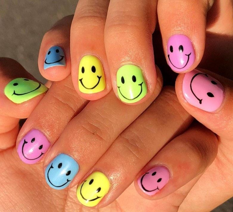 Smiley face colorful nails