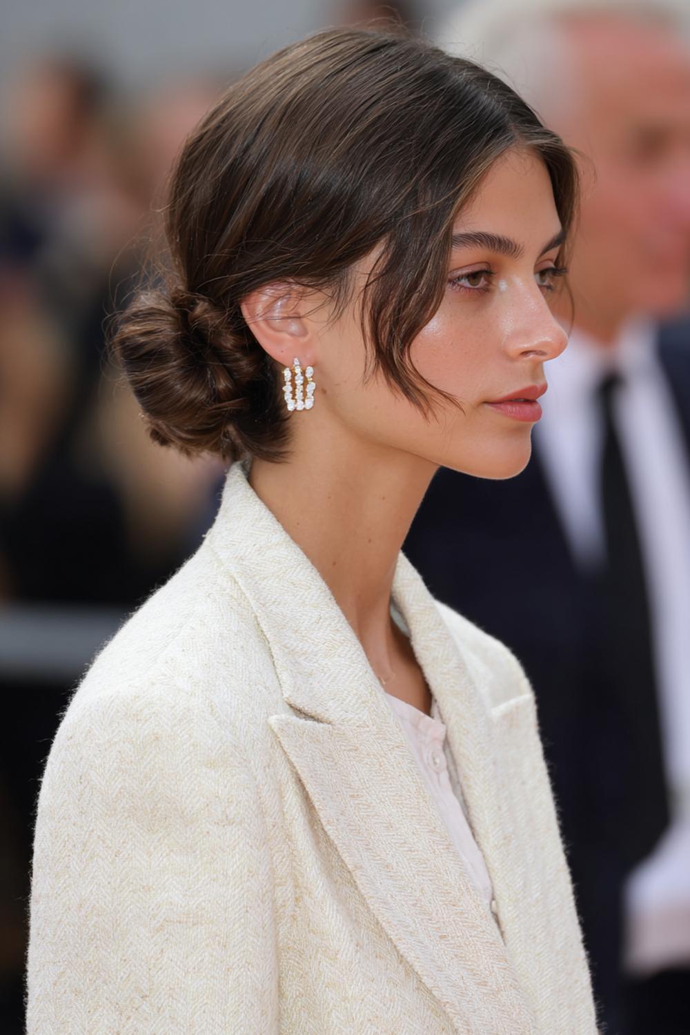 10. Trendy Hair Looks 2026: Low Bun with Clean Middle Part and Soft Tendrils