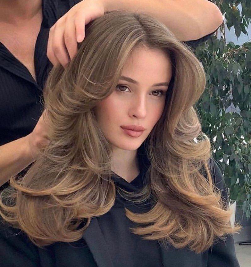 Layered blowout with curtain bangs