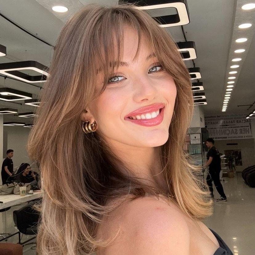 Wispy curtain bangs layered hair
