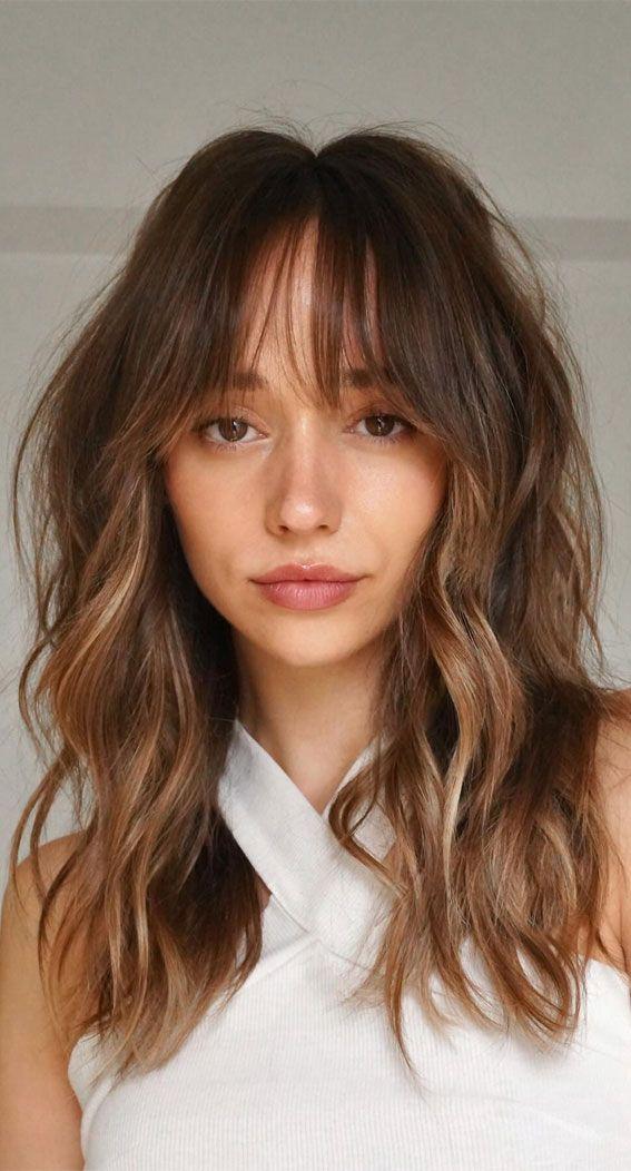 Wispy curtain bangs wavy hairstyle