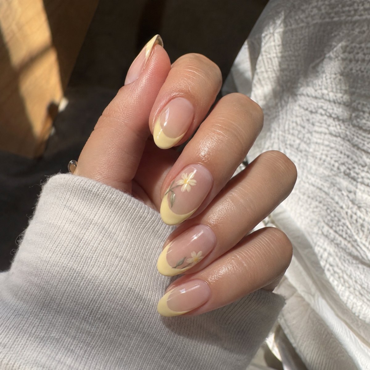 Yellow floral French tip nails