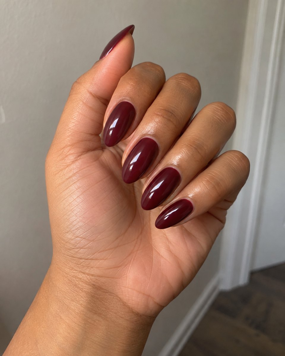 Glossy burgundy almond nails